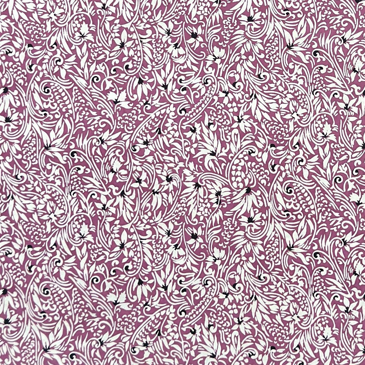 a sheet of Japanese silkscreen printed chiyogami yuzen paper with a micro floral pattern in aubergine, white and black