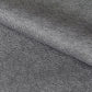 a sheet of Japanese chiyogami paper with a black background and a small pattern of white dots in repeating arch shape
