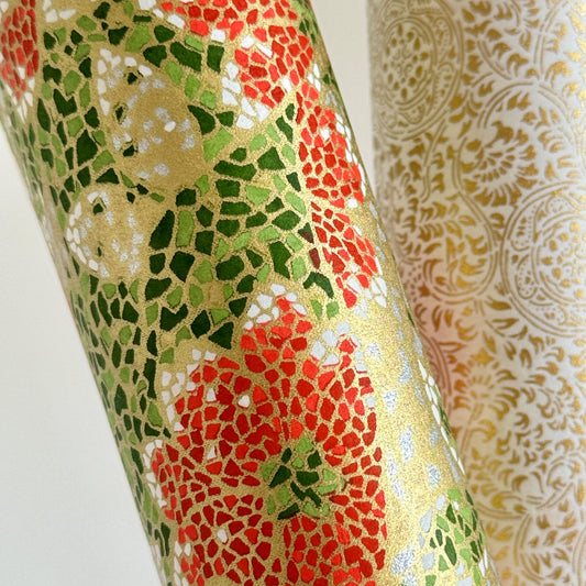 Japanese silkscreen chiyogami paper with a mosaic pattern of scarlet chrysanthemums on gold with green foliage. Close up