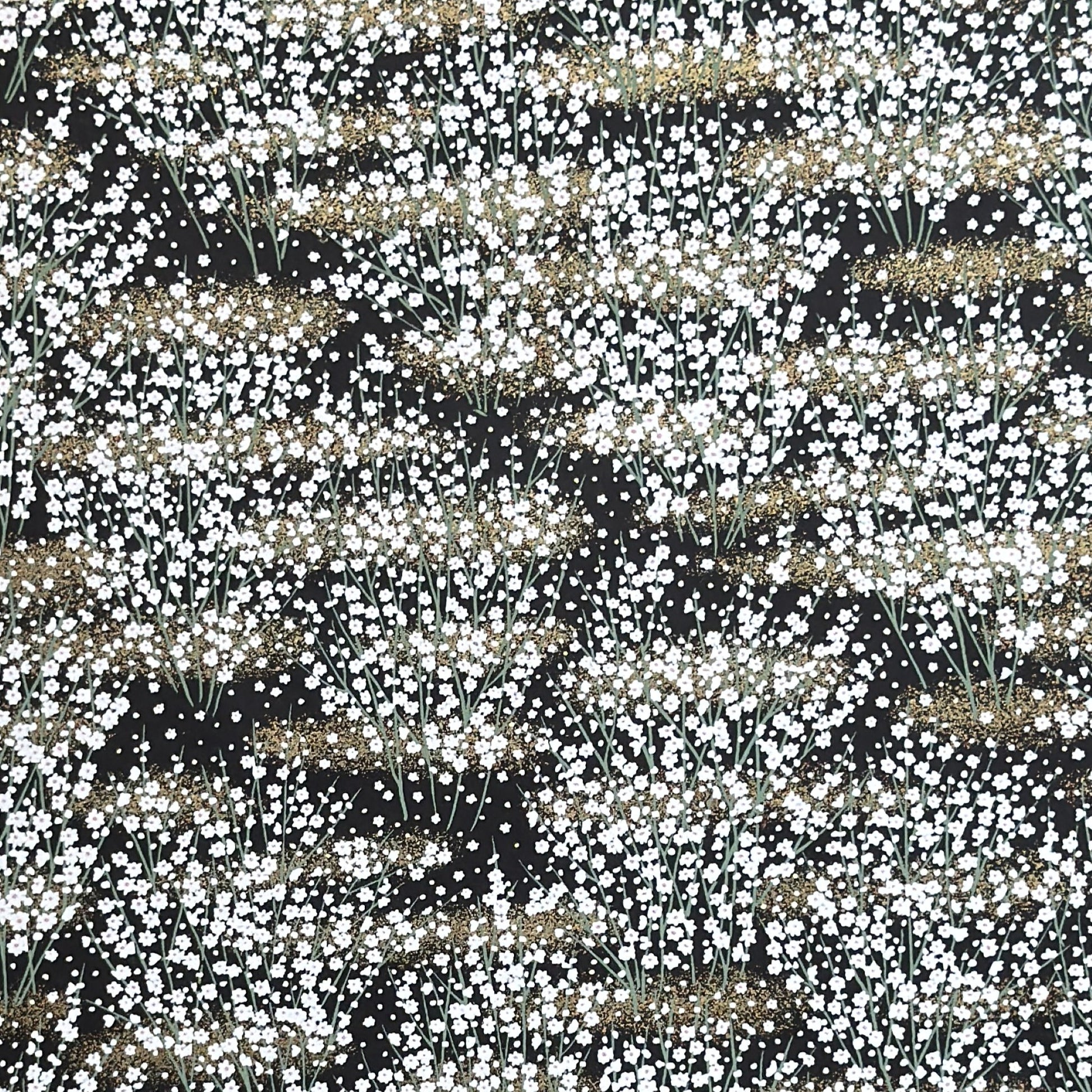 a sheet of chiyogami paper with a dainty spread of little white flowers with gold on a black ground