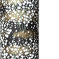 a sheet of chiyogami paper with a dainty spread of little white flowers with gold on a black ground