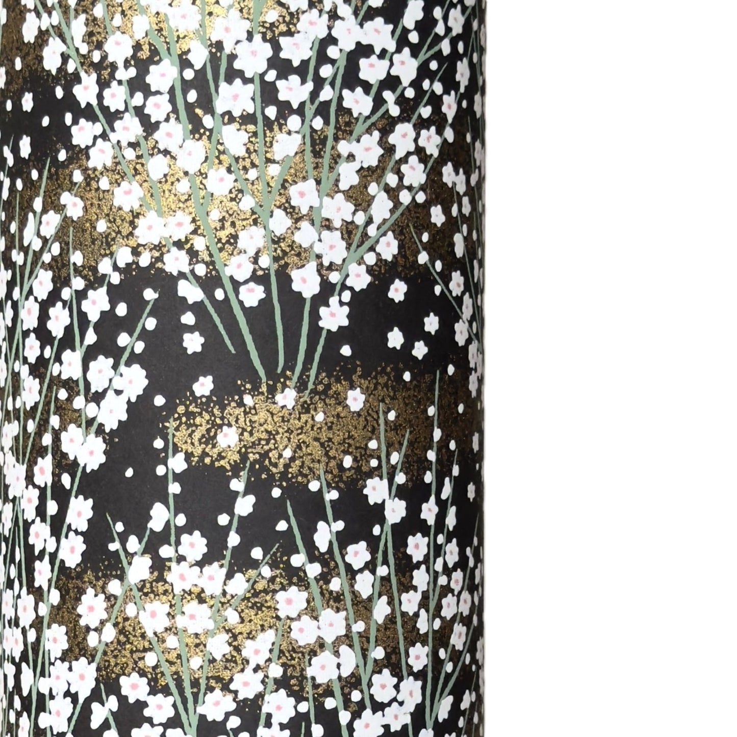 a sheet of chiyogami paper with a dainty spread of little white flowers with gold on a black ground