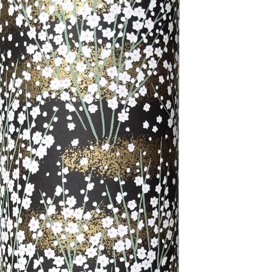a sheet of chiyogami paper with a dainty spread of little white flowers with gold on a black ground