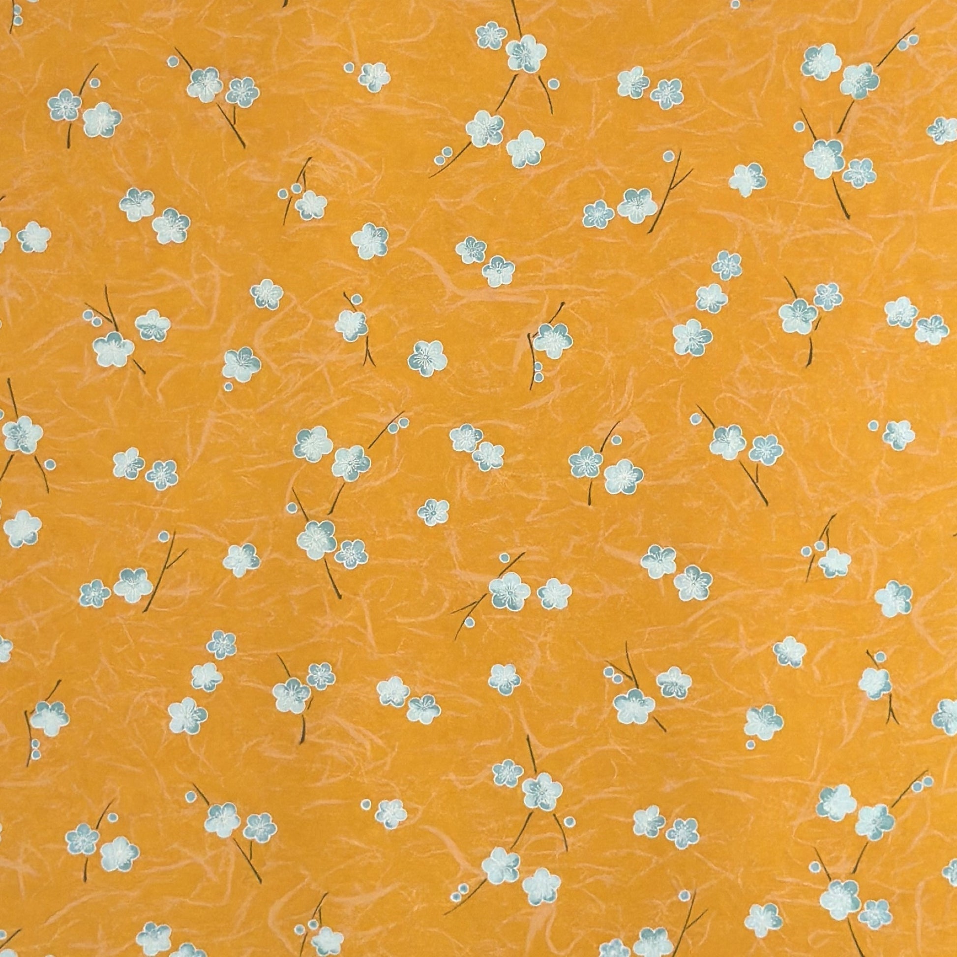 Pale blue plum (ume) blossom with a rich saffron backdrop.  Japanese chiyogami paper.
