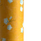 Pale blue plum (ume) blossom with a rich saffron backdrop.  Japanese chiyogami paper. Close up