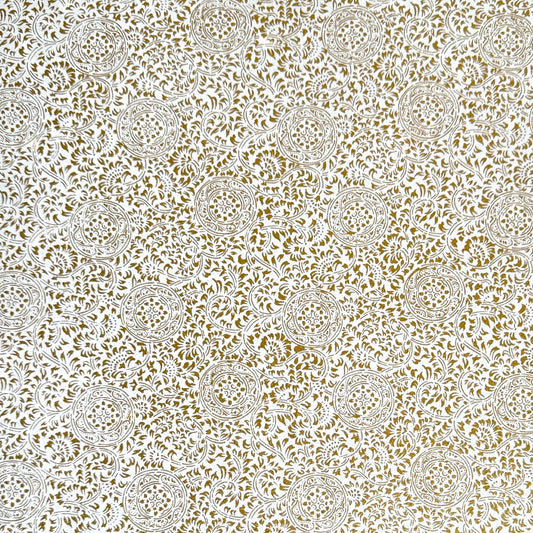 Japanese silkscreen chiyogami paper with an intricate floral pattern in gold on ivory white.