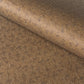 a sheet of brown Japanese chiyogami paper with tiny white polka dots