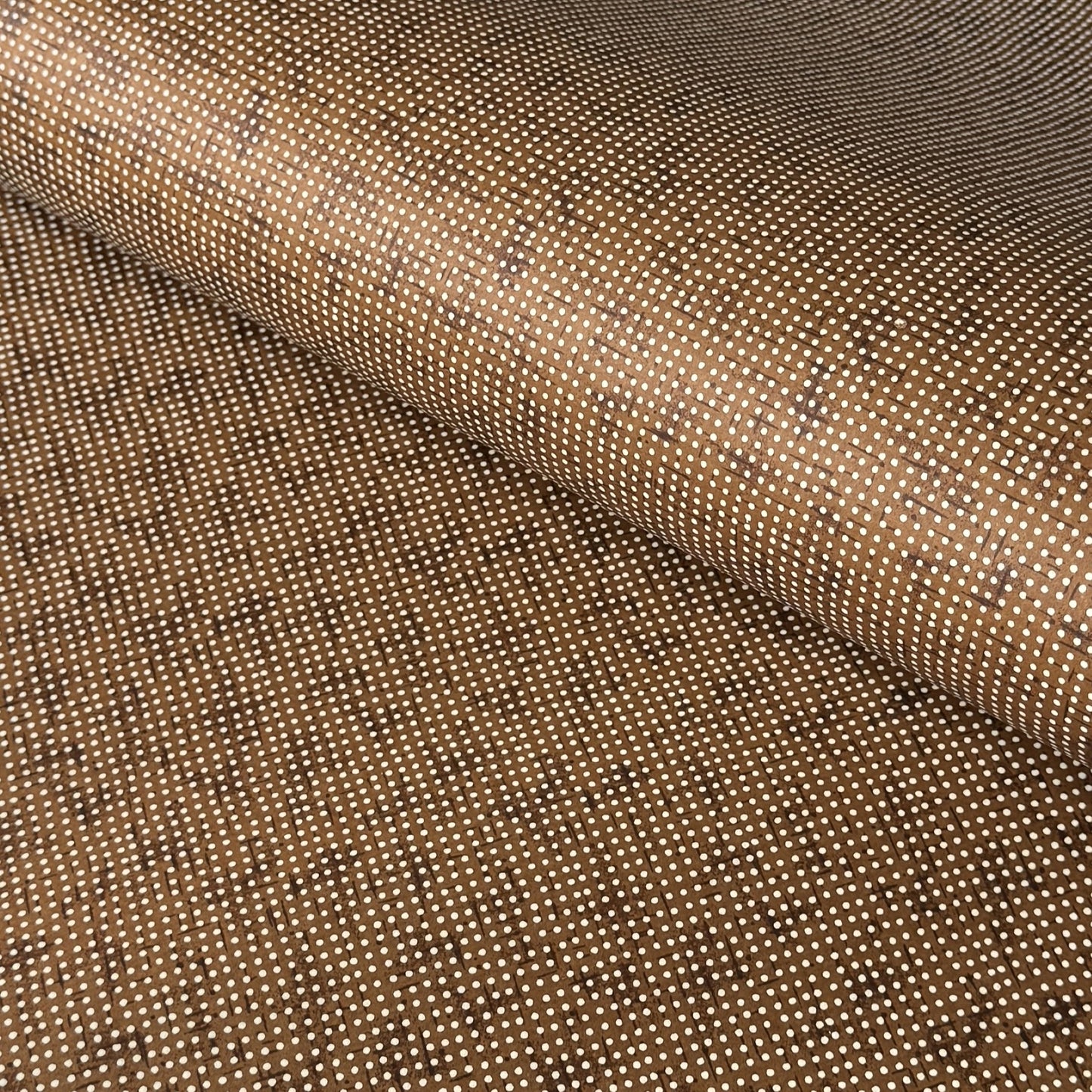 a sheet of brown Japanese chiyogami paper with tiny white polka dots
