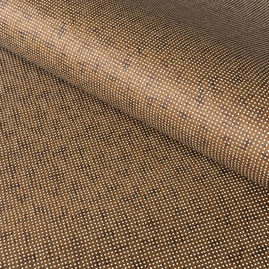 a sheet of brown Japanese chiyogami paper with tiny white polka dots