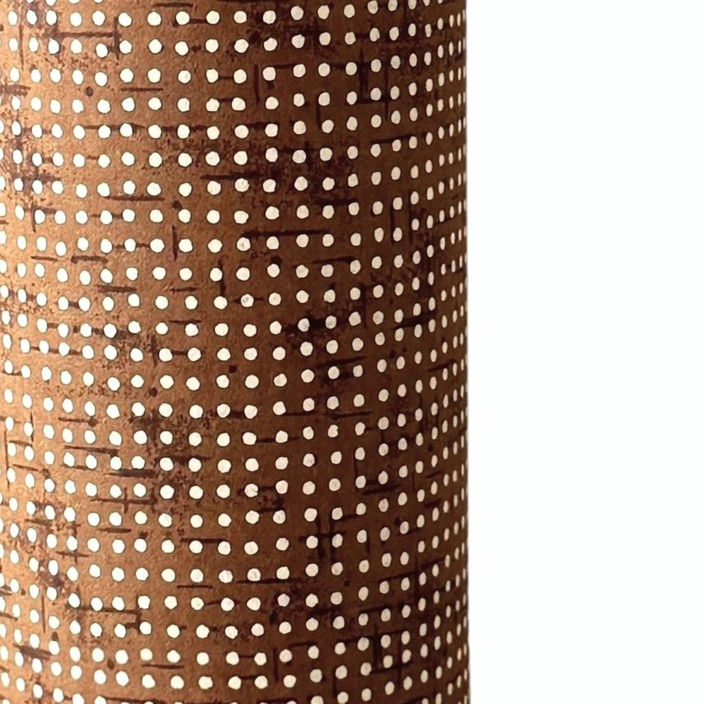 a sheet of brown Japanese chiyogami paper with tiny white polka dots