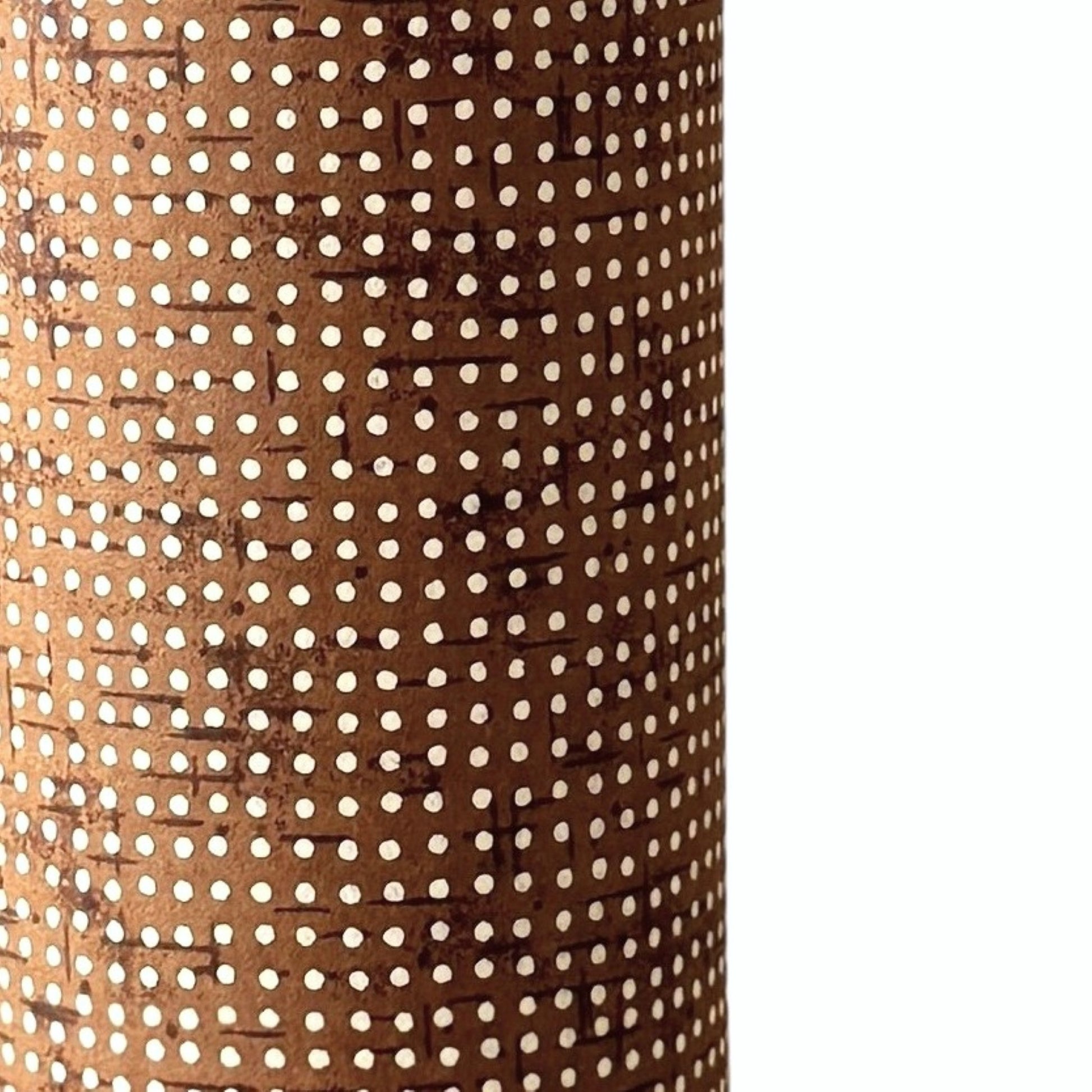 a sheet of brown Japanese chiyogami paper with tiny white polka dots