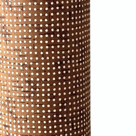 a sheet of brown Japanese chiyogami paper with tiny white polka dots