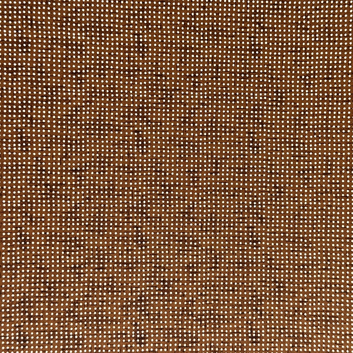 a sheet of brown Japanese chiyogami paper with tiny white polka dots