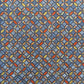 a sheet of Japanese silkscreen printed chiyogami yuzen paper with a design of overlapping circles in blue, red, yellow and white