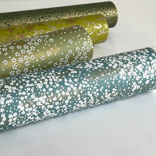 An abundance of tiny white flowers on soft teal with a dusting of gold. Japanese chiyogami paper