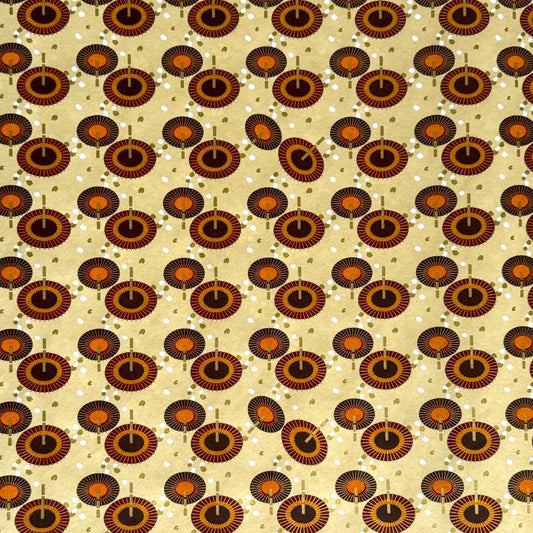 Japanese silkscreen chiyogami paper with a brown and orange umbrella pattern on a buttermilk backdrop 