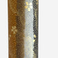 japanese chiyogami paper in stripes of black, brown, ochre and grey with gold clouds and flowers. Close up