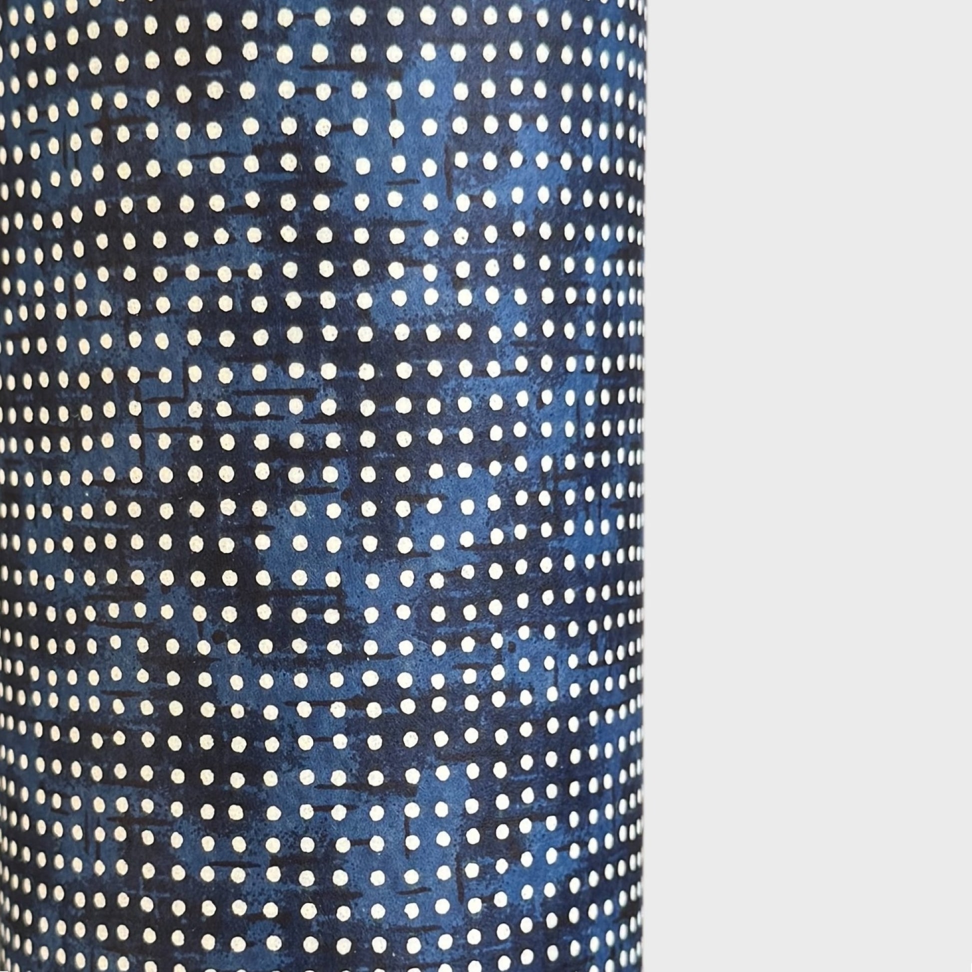 a sheet of indigo Japanese chiyogami paper with tiny white polka dots