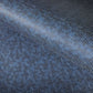 a sheet of indigo Japanese chiyogami paper with tiny white polka dots