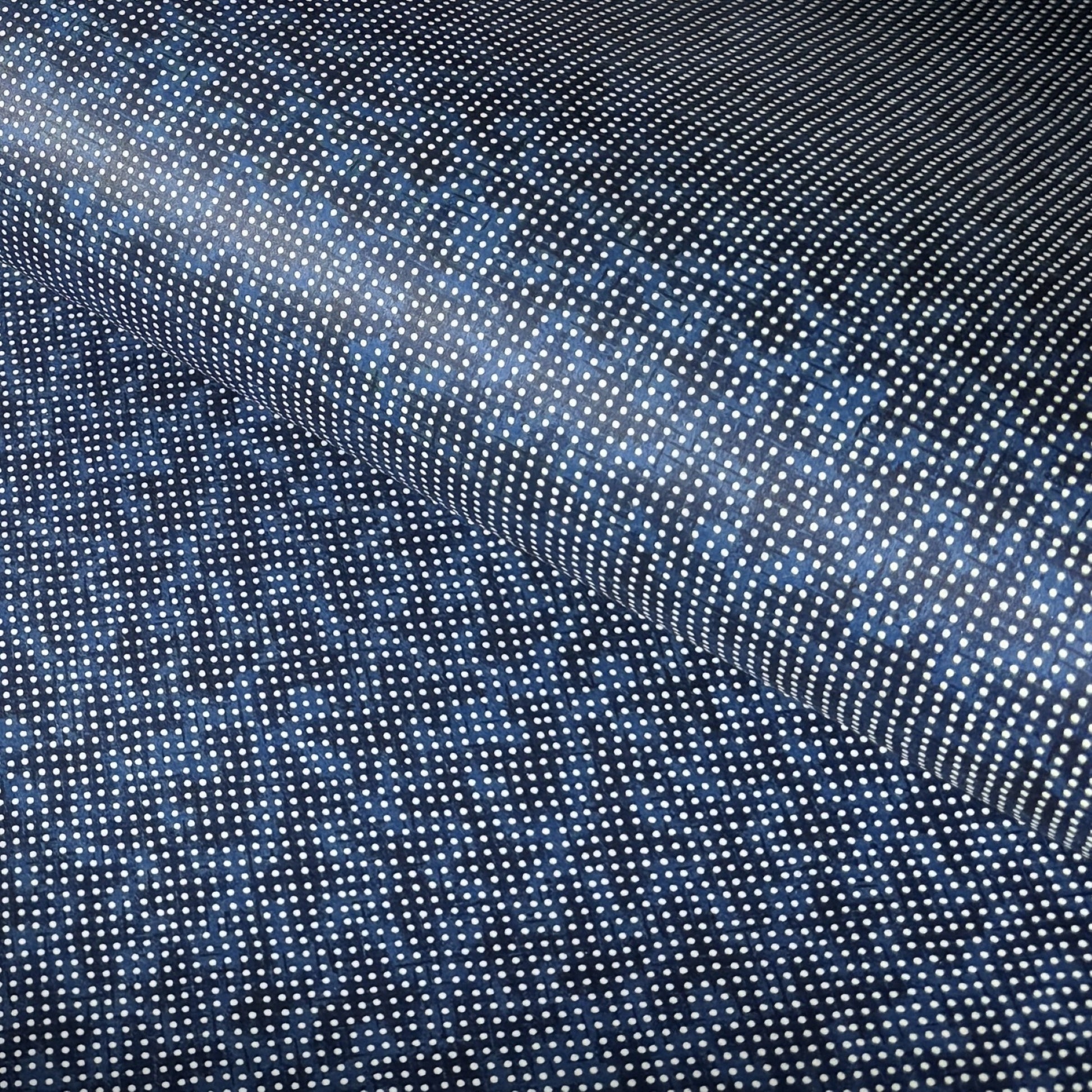 a sheet of indigo Japanese chiyogami paper with tiny white polka dots
