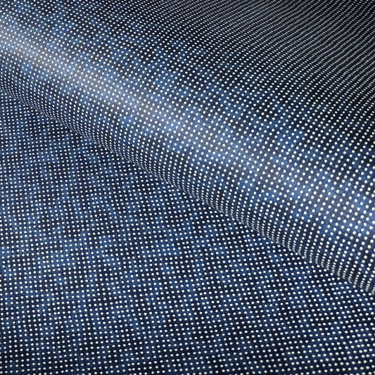 a sheet of indigo Japanese chiyogami paper with tiny white polka dots