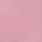 a sheet of chiyogami paper with a pink background and little irregular white dots with a gold center