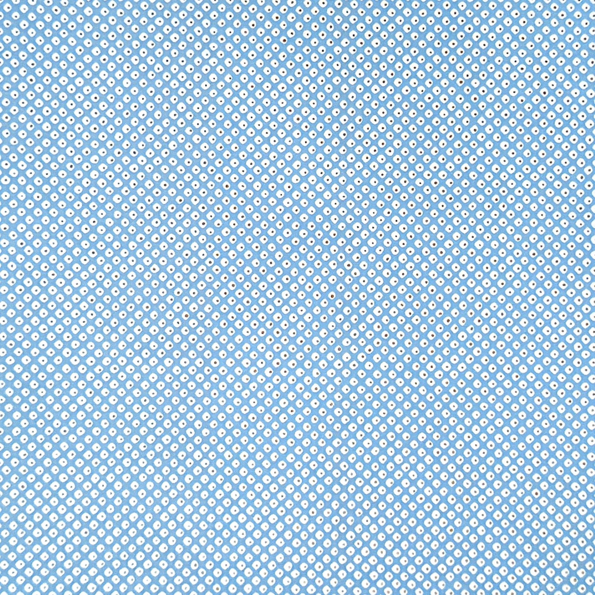 a sheet of chiyogami paper with a sky blue background and little irregular white dots with a silver centre