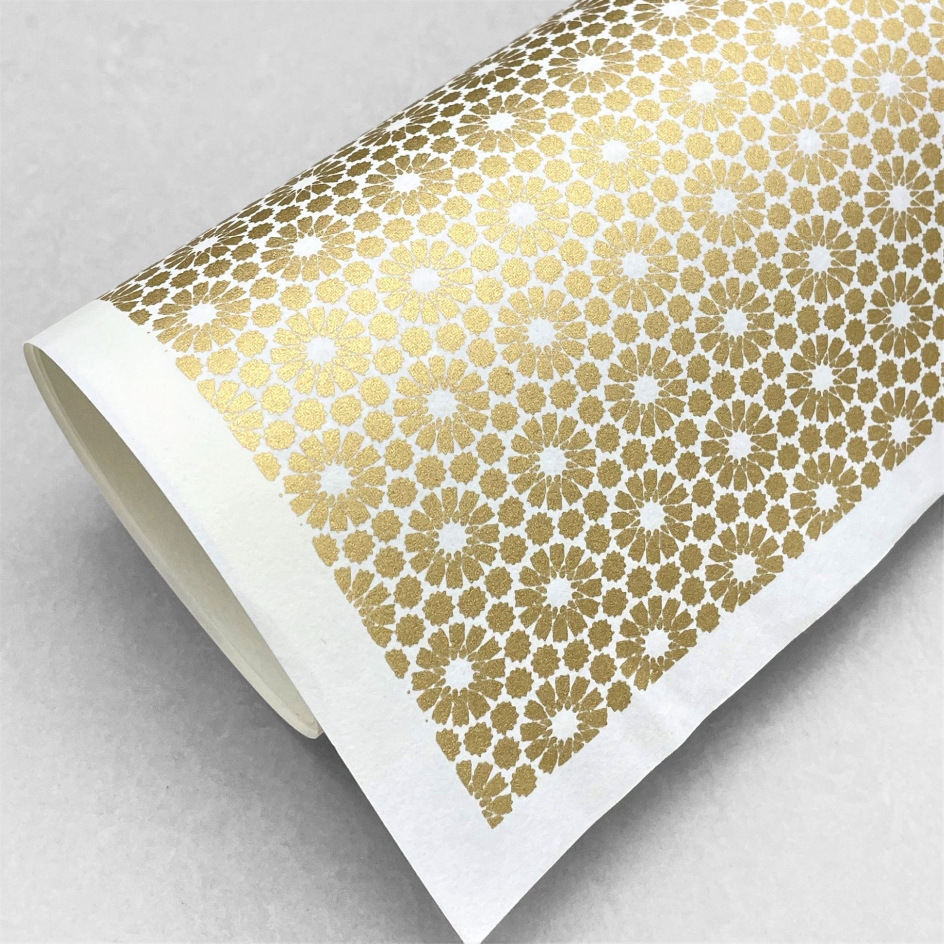 japanese silk-screen handmade paper showing gold repeat chrysanthemum flower motif repeat