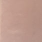 a sheet of Japanese chiyogami paper with a blush pink background and a small pattern of white dots in repeating arch shape