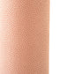 a sheet of Japanese chiyogami paper with a blush pink background and a small pattern of white dots in repeating arch shape