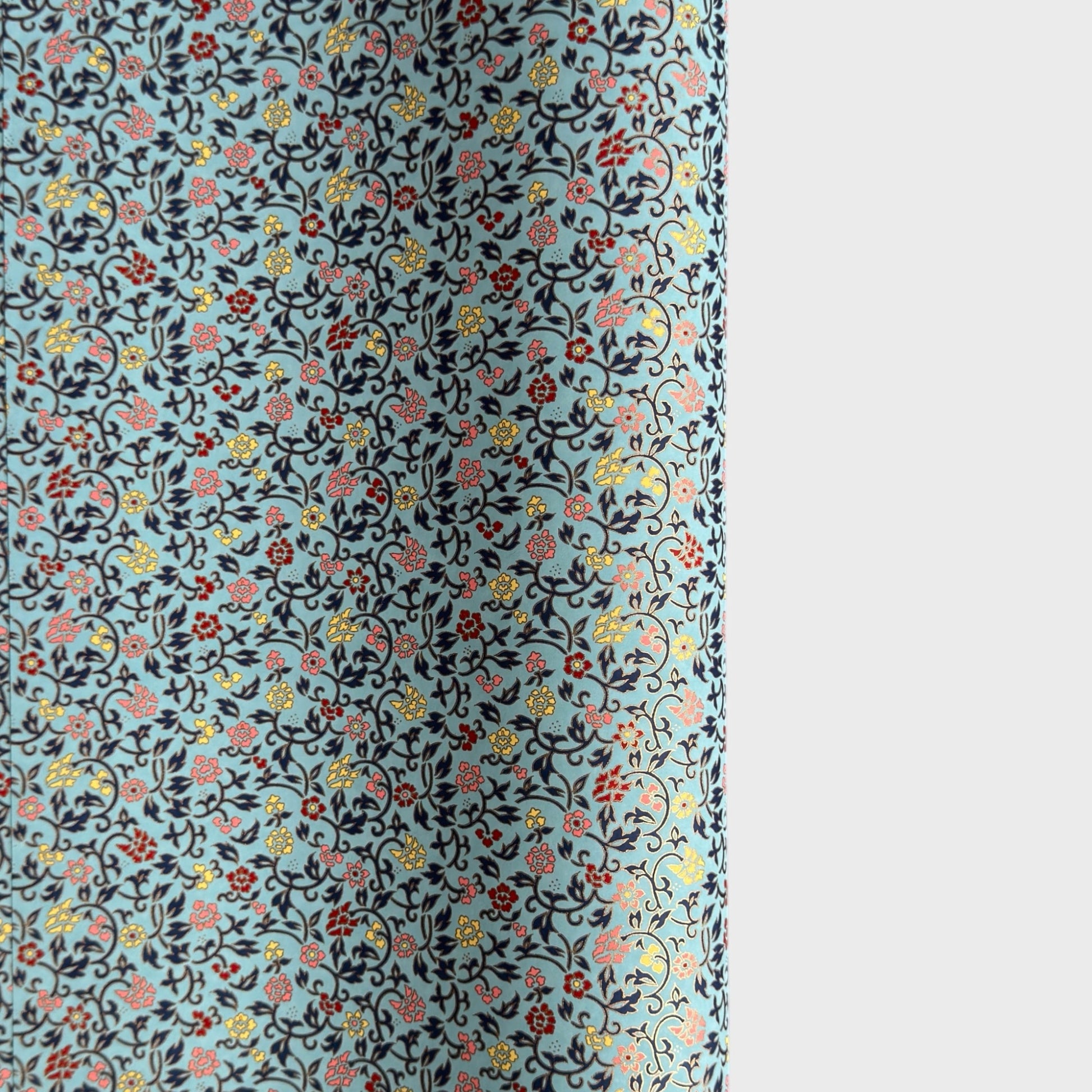 Japanese silkscreen chiyogami paper with a dainty floral pattern in navy, yellow and coral on a teal backdrop. Finished with gold metallic ink.