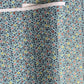 Japanese silkscreen chiyogami paper with a dainty floral pattern in navy, yellow and coral on a teal backdrop. Finished with gold metallic ink.
