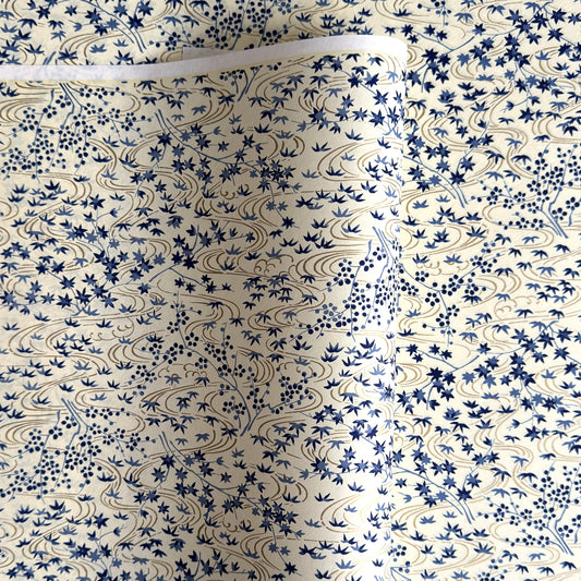 japanese silk-screen handmade paper showing gold rivers and blue falling leaves and foliage