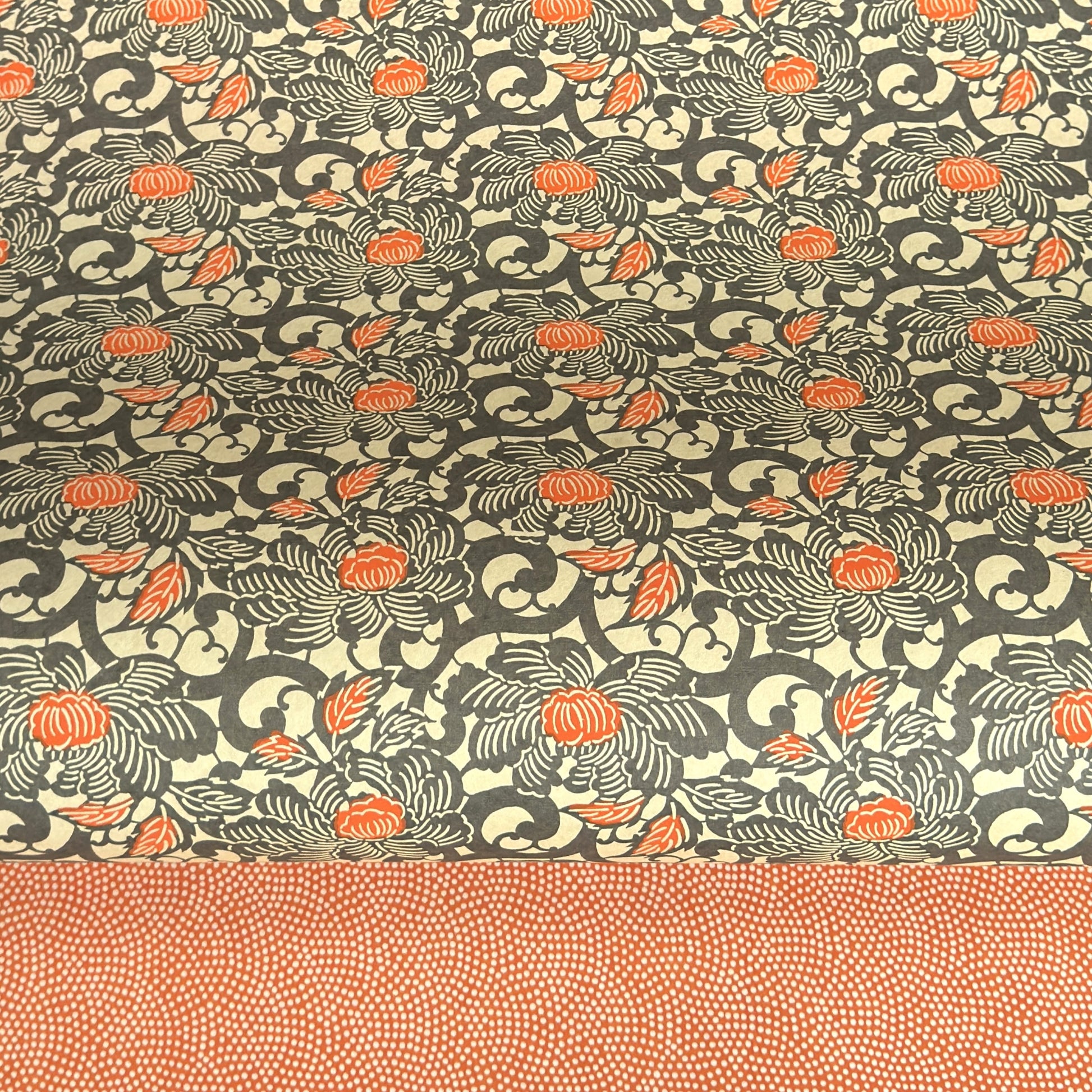 japanese silk-screen handmade paper showing grey and orange peony flower repeat pattern