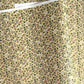 Japanese chiyogami silkscreen paper with a dainty floral pattern on a creamy backdrop and finished with gold metallic ink. 
