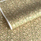 Japanese chiyogami silkscreen paper with a dainty floral pattern on a creamy backdrop and finished with gold metallic ink. 
