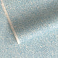Japanese chiyogami paper - silkscreen printed - light blue backdrop with a small botanical pattern in white with silver accents.