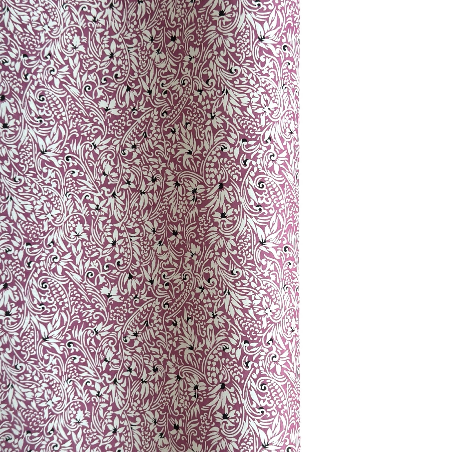 a sheet of Japanese silkscreen printed chiyogami yuzen paper with a micro floral pattern in aubergine, white and black