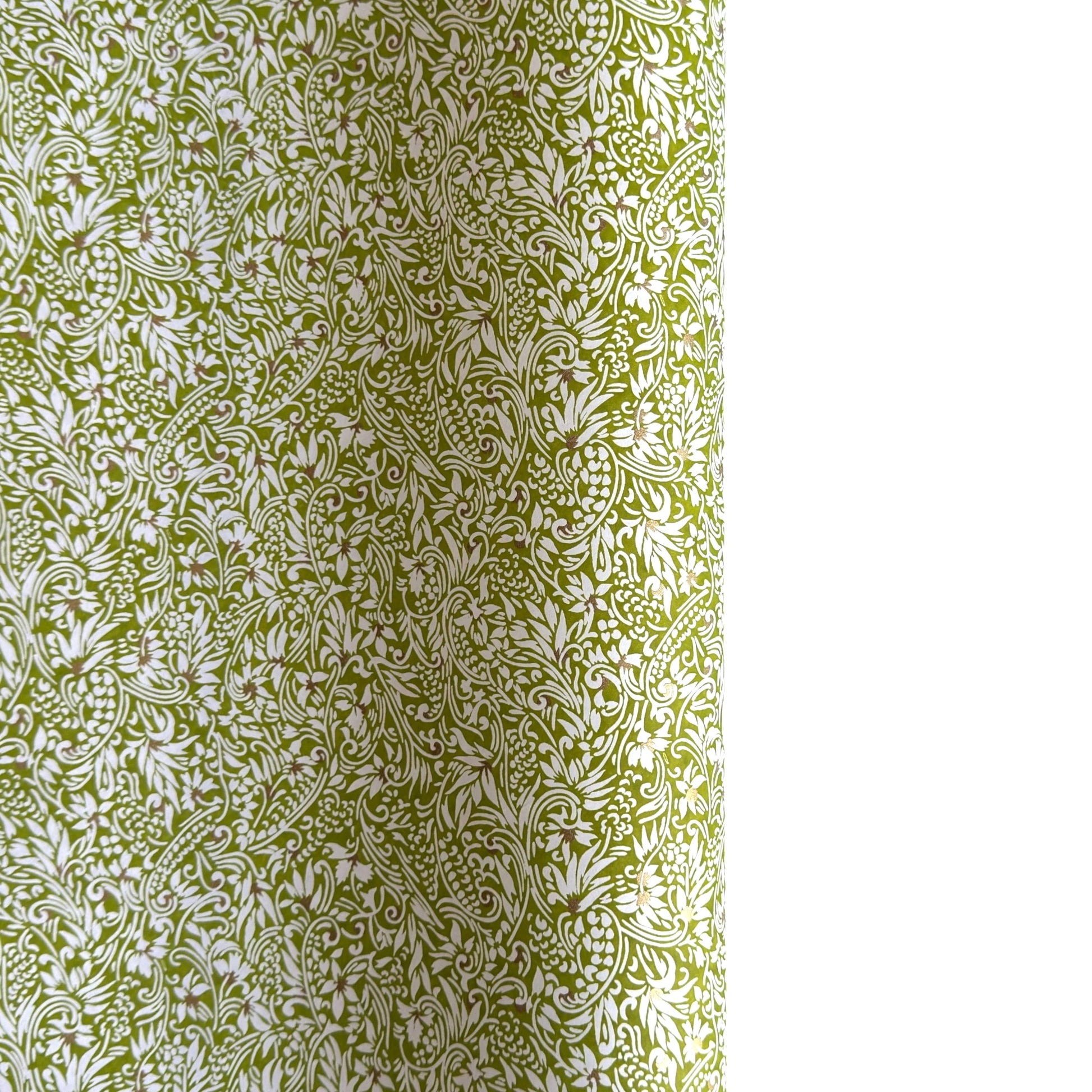 japanese silk-screen handmade paper showing green and white botanical repeat pattern with gold highlights