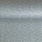 Japanese silkscreen chiyogami paper with a two-tone sky blue geometric pattern on creamy white