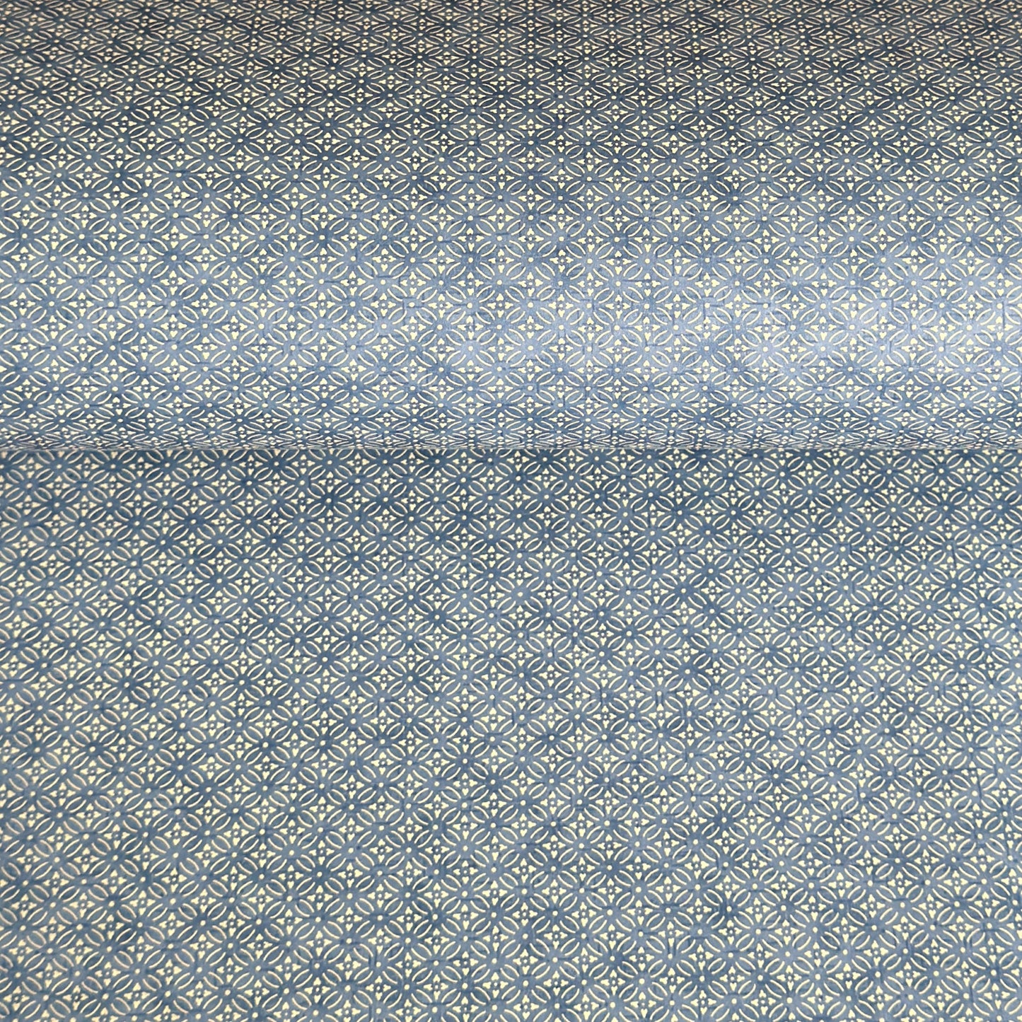 Japanese silkscreen chiyogami paper with a two-tone sky blue geometric pattern on creamy white
