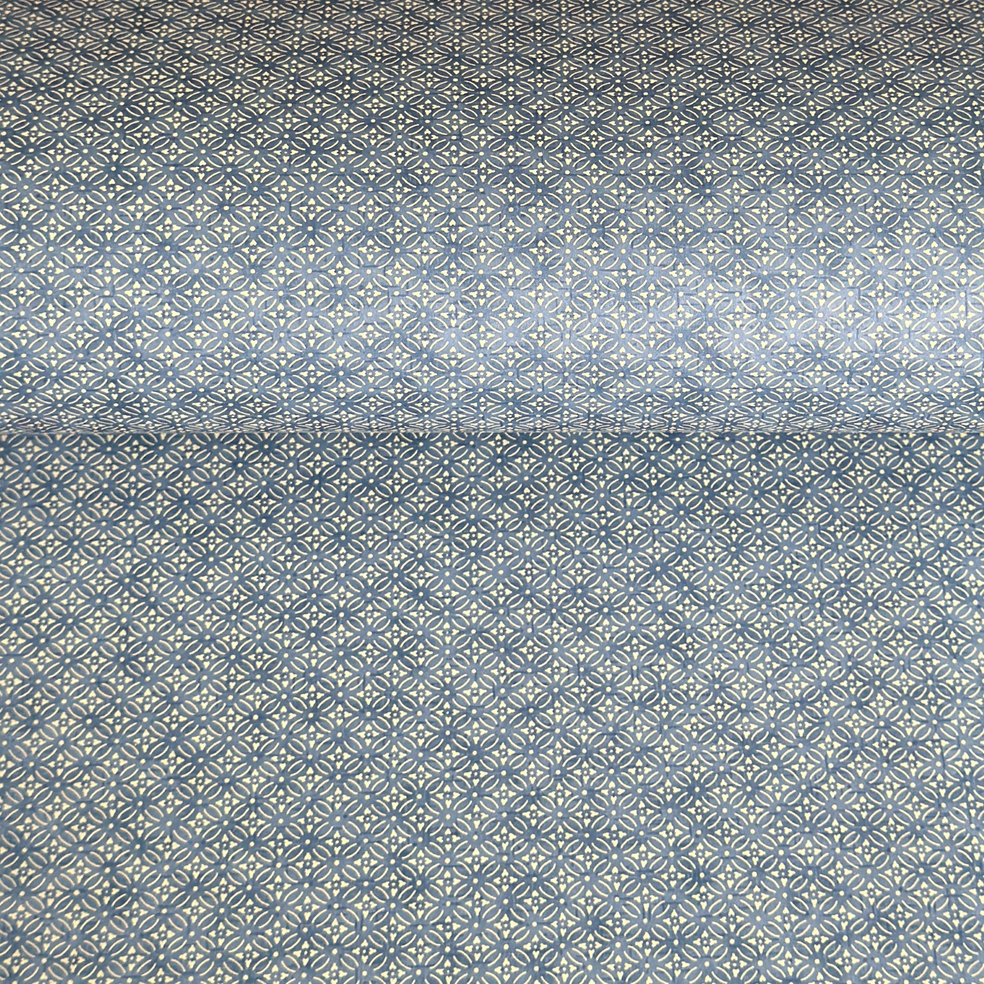 Japanese silkscreen chiyogami paper with a two-tone sky blue geometric pattern on creamy white