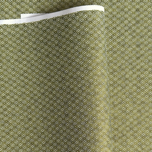 Japanese silkscreen chiyogami paper with a two-tone rich green geometric pattern on creamy white