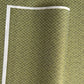 Japanese silkscreen chiyogami paper with a two-tone rich green geometric pattern on creamy white