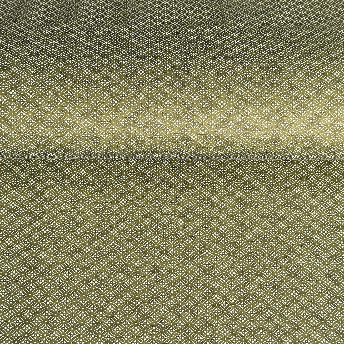 Japanese silkscreen chiyogami paper with a two-tone rich green geometric pattern on creamy white