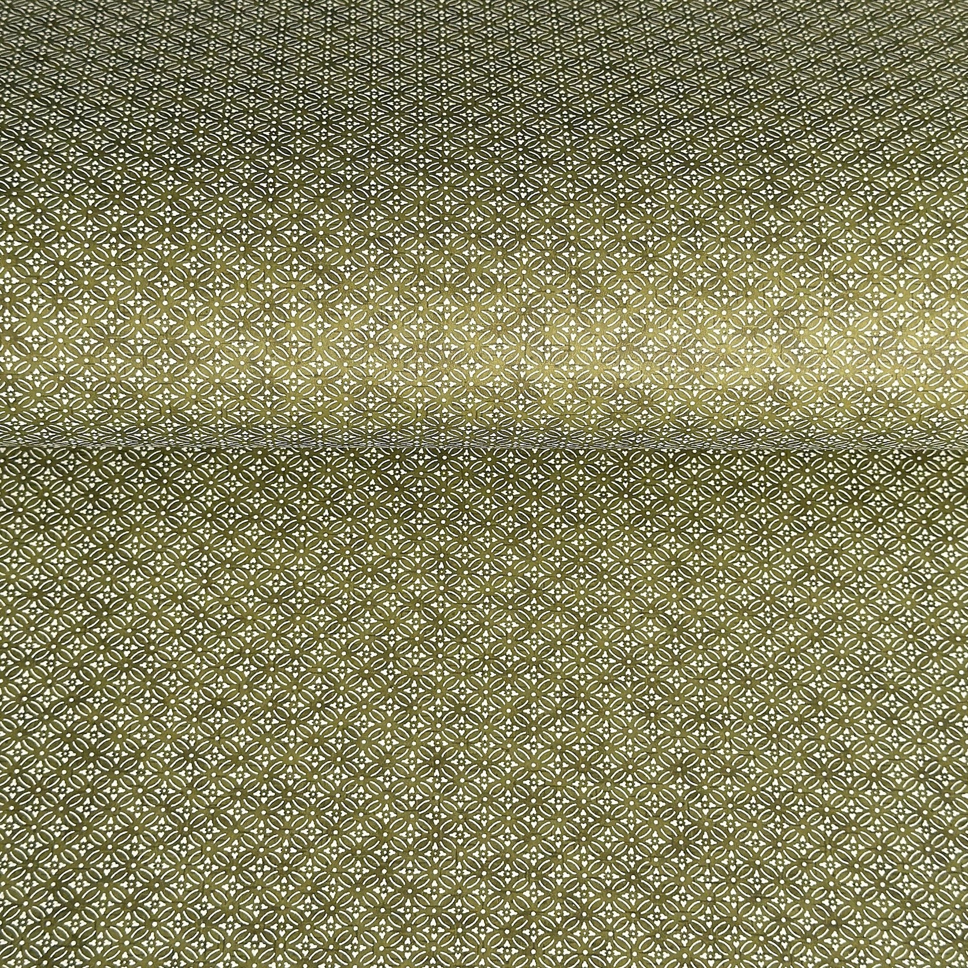 Japanese silkscreen chiyogami paper with a two-tone rich green geometric pattern on creamy white