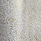 Japanese silkscreen chiyogami paper with an intricate floral pattern in gold on ivory white.