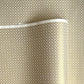 a sheet of Japanese silkscreen printed chiyogami yuzen paper with a micro gold geometric pattern on white backdrop. 