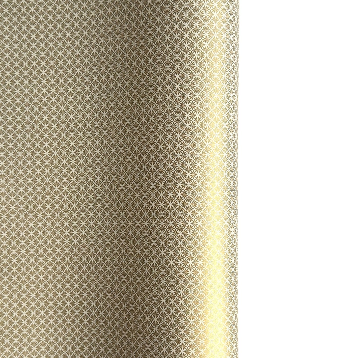 a sheet of Japanese silkscreen printed chiyogami yuzen paper with a micro gold geometric pattern on white backdrop. 