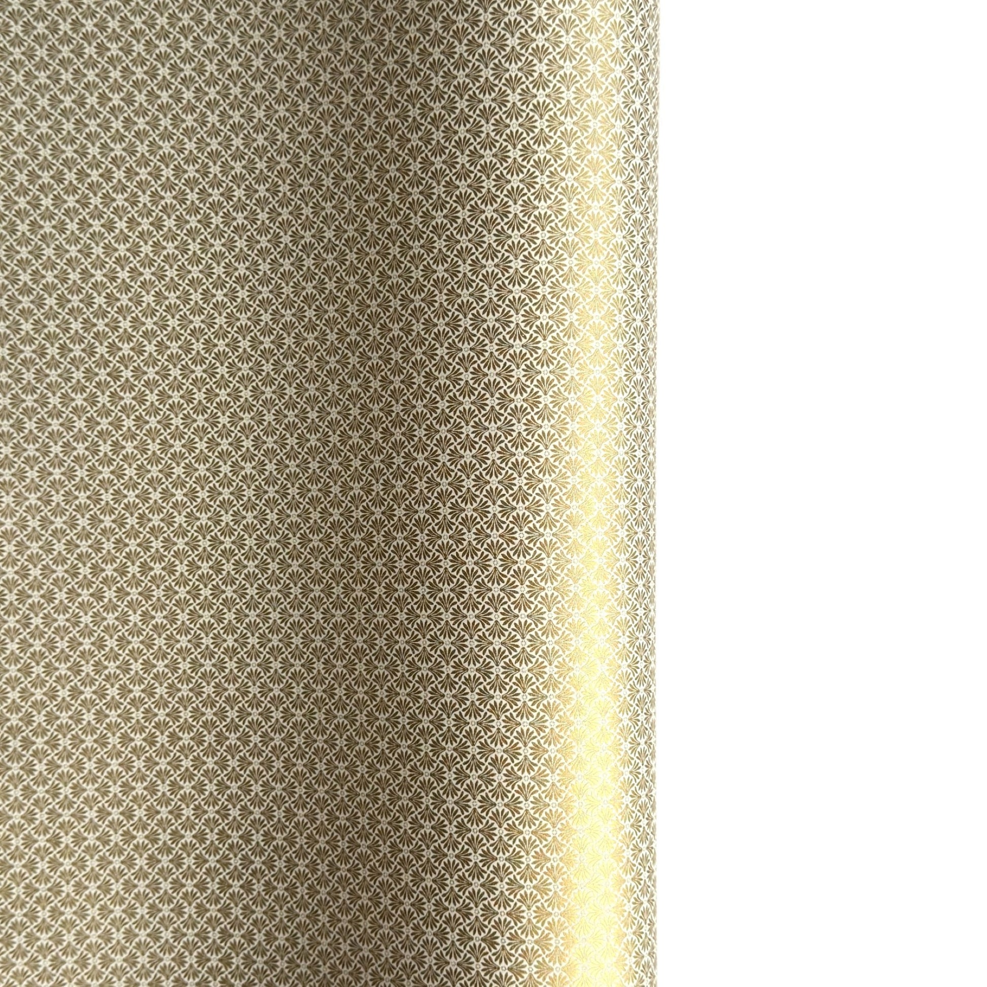 a sheet of Japanese silkscreen printed chiyogami yuzen paper with a micro gold geometric pattern on white backdrop. 